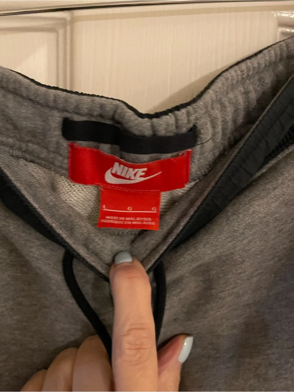 Nike Gray Sweatpants with Black Drawstring and Red Logo Tag